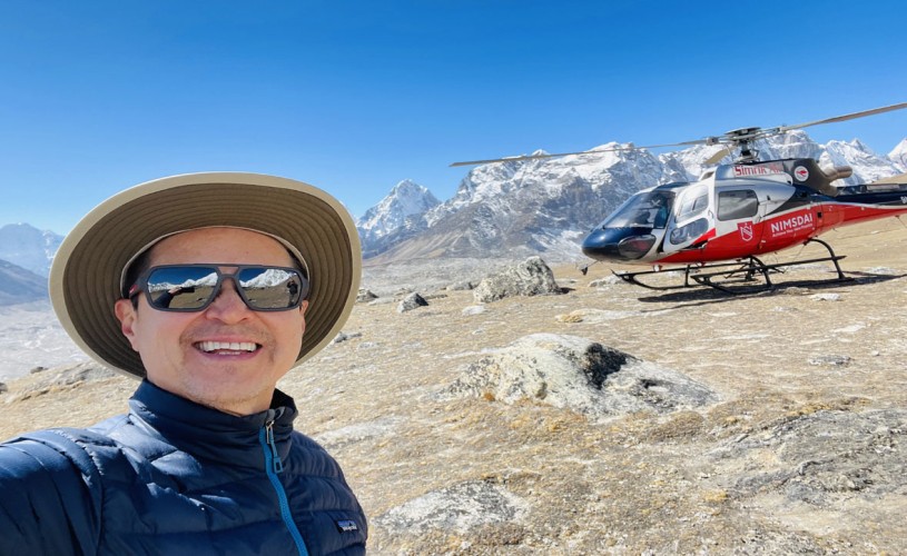 A helicopter landing on the shores of Gokyo Lake